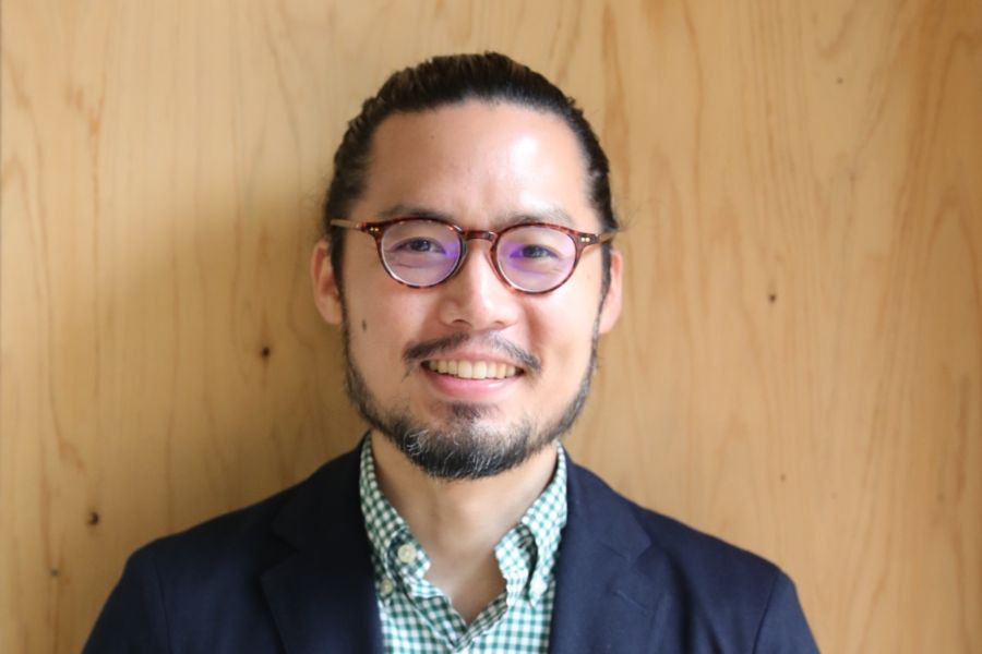 A man smiling into the camera.